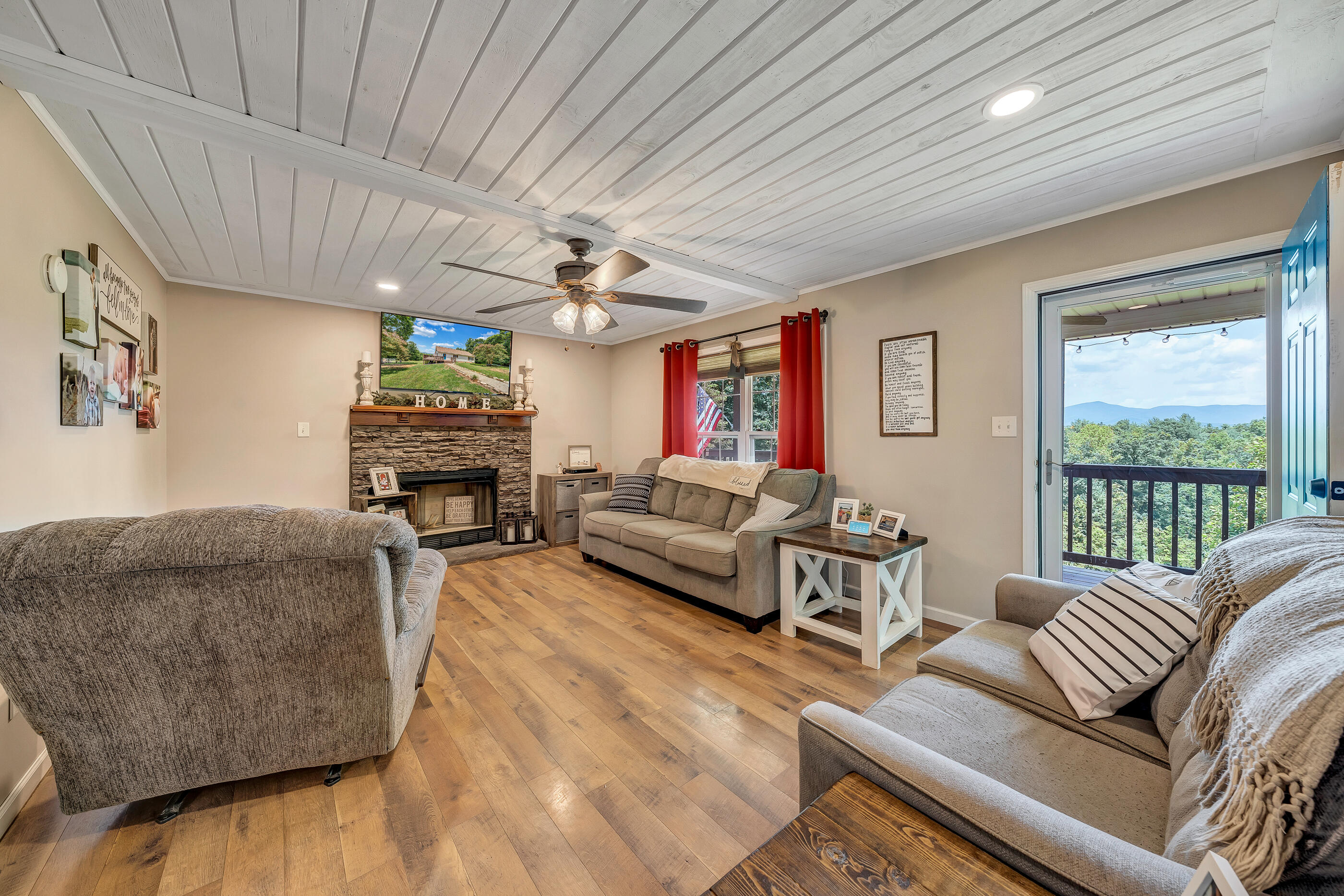 1145 Madcap Road Rocky Mount, VA 24151 - Photo 22 of 38 a living room with furniture and a large window