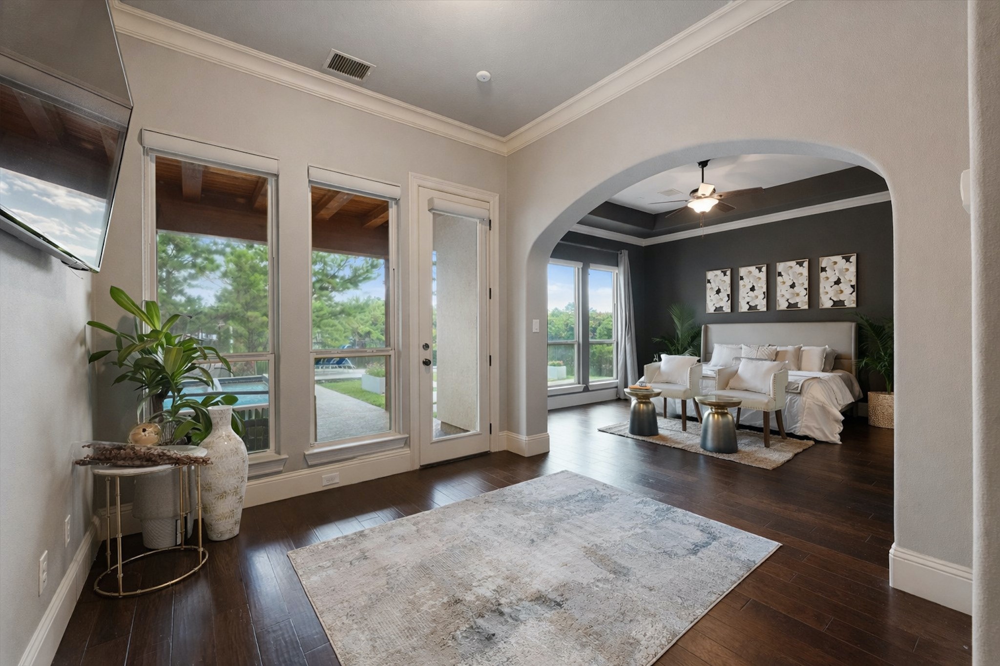 19 Paloma Bend Place Spring, TX 77389 - Photo 26 of 50 Primary bedroom features direct backyard access, abundant natural light, and unobstructed views of Lake Paloma and the backyard.