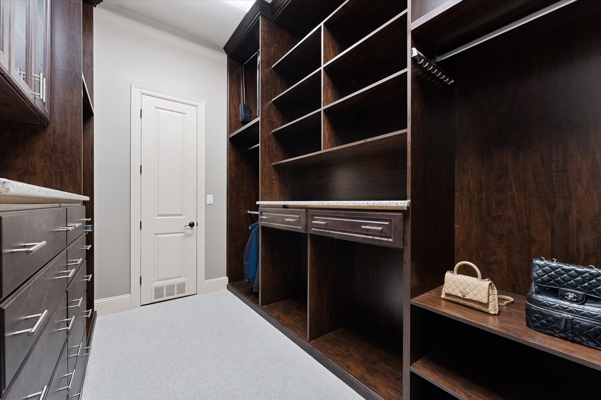 19 Paloma Bend Place Spring, TX 77389 - Photo 32 of 50 Primary walk-in closet with access to utility room/laundry room.