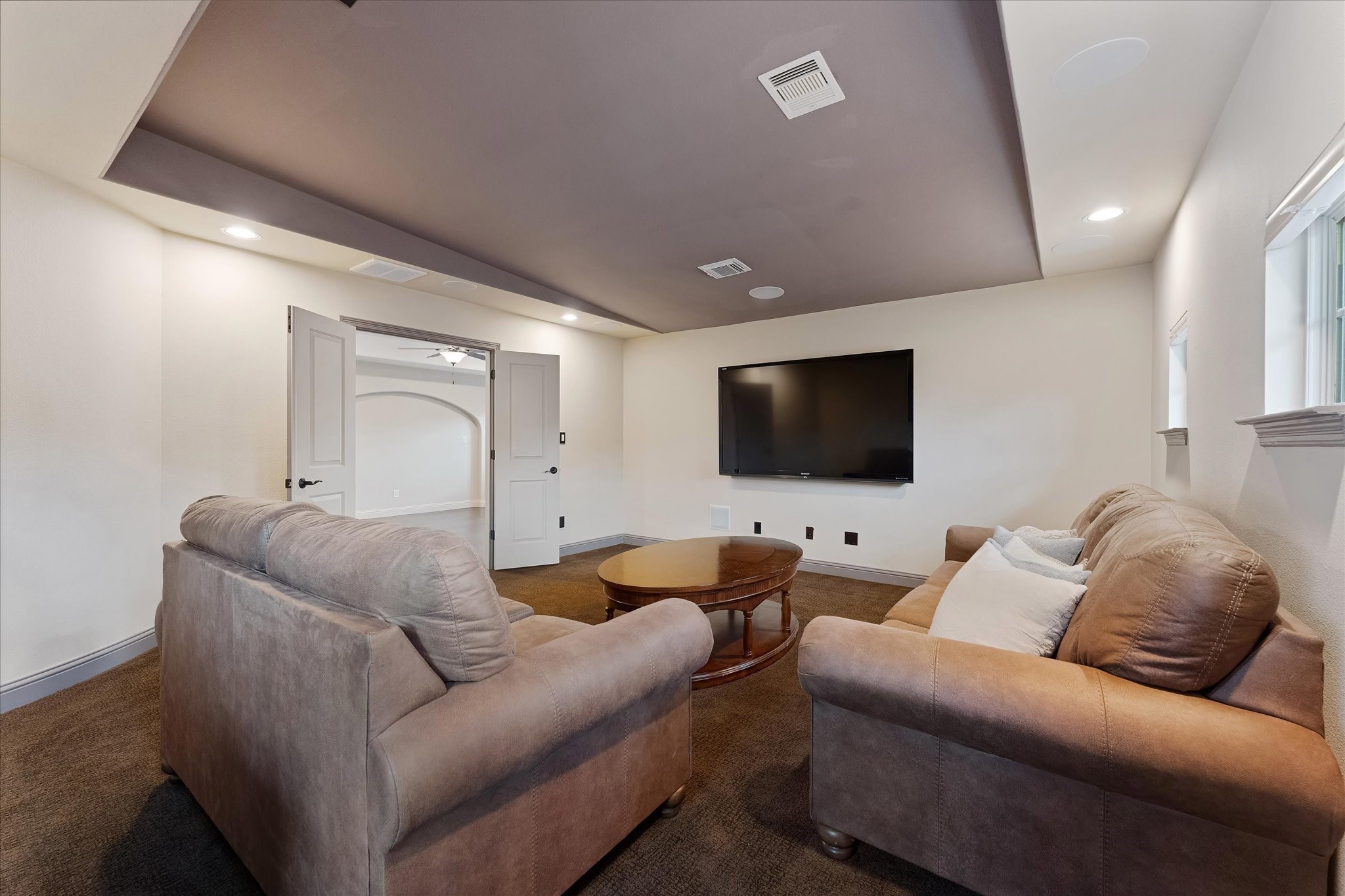 19 Paloma Bend Place Spring, TX 77389 - Photo 42 of 50 media room with beverage cooler and dry bar.