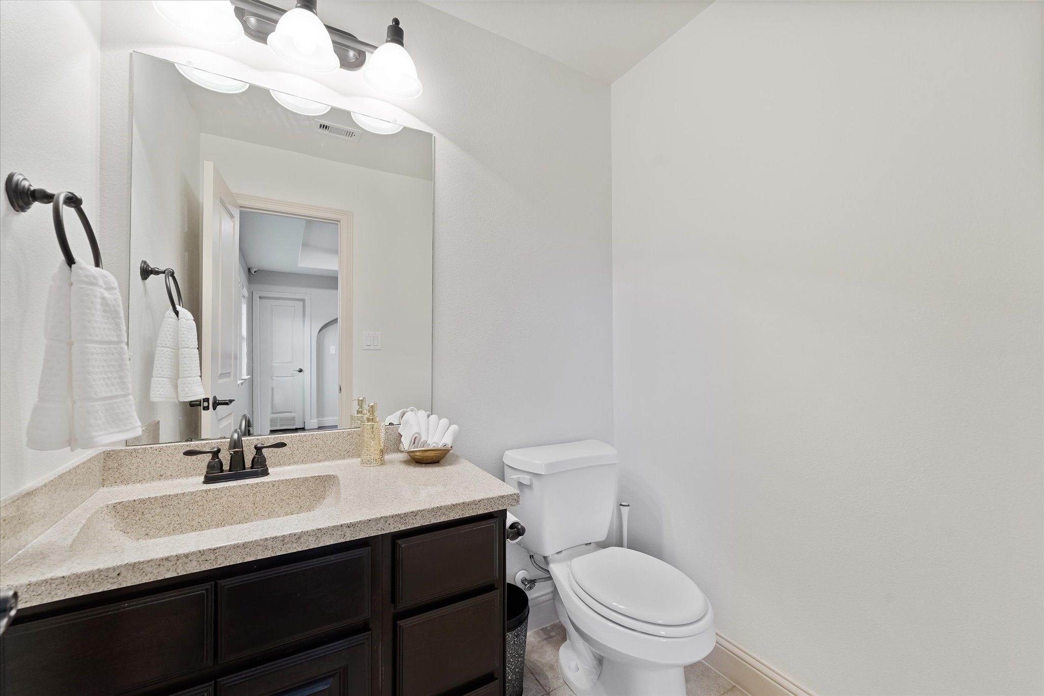 19 Paloma Bend Place Spring, TX 77389 - Photo 43 of 50 half bath just off the flex room/game room and media room.