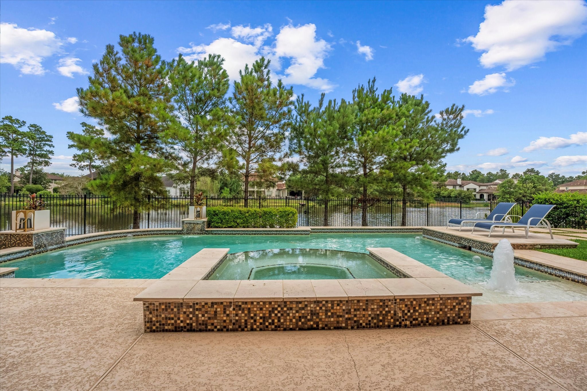 19 Paloma Bend Place Spring, TX 77389 - Photo 5 of 50 Only one neighbor and an adjacent wooded lot provide exceptional privacy, along with unobstructed Lake Paloma views and direct lake access—perfect for paddle boarding and kayaking.