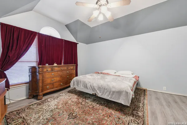 a bedroom with a bed and a cabinets