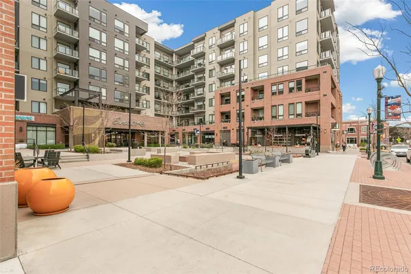 a view of a building with sitting area