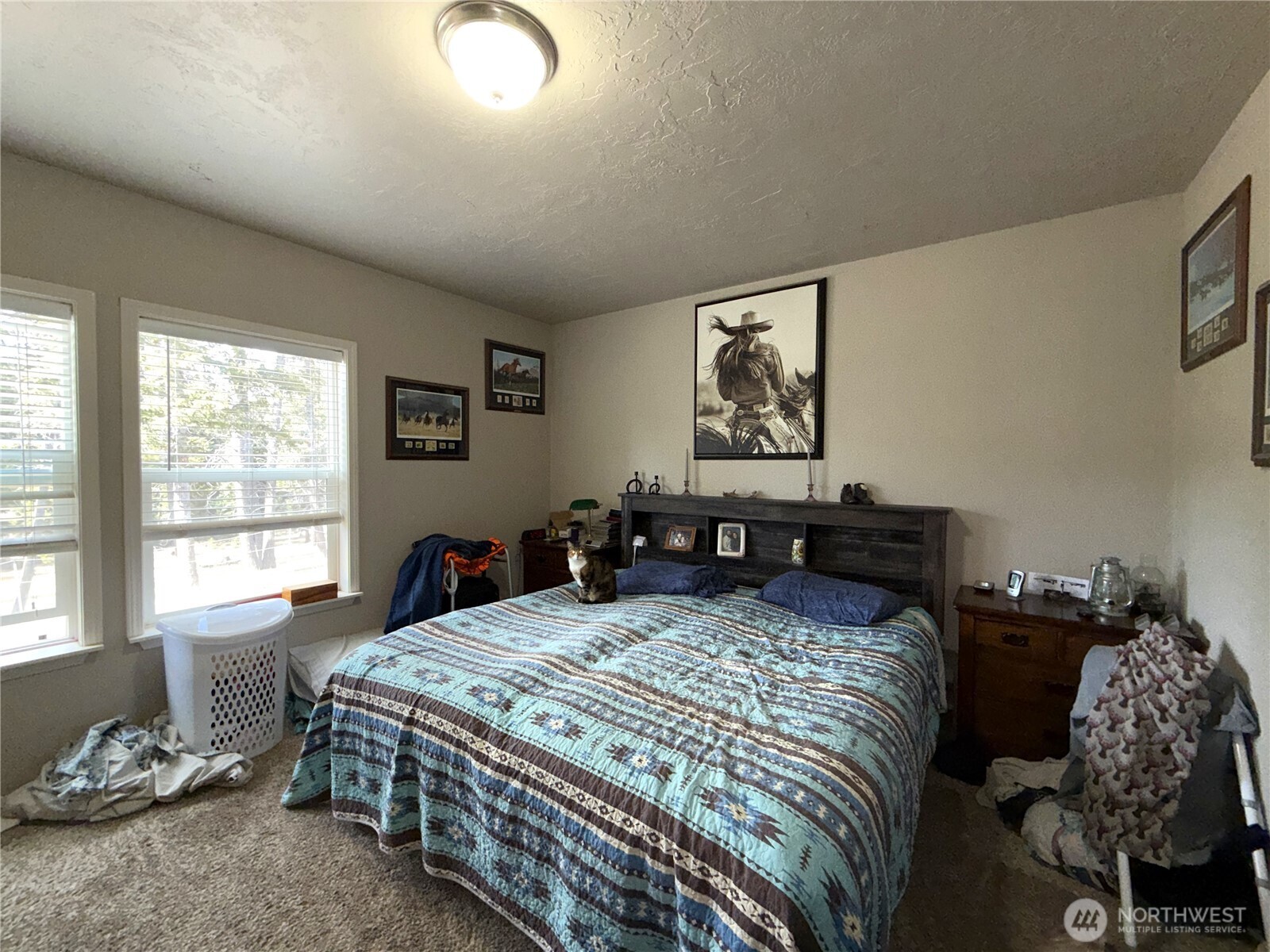 116 Cape Labelle Road Wauconda, WA 98859 - Photo 6 of 35 a bed sitting in a bedroom next to a window