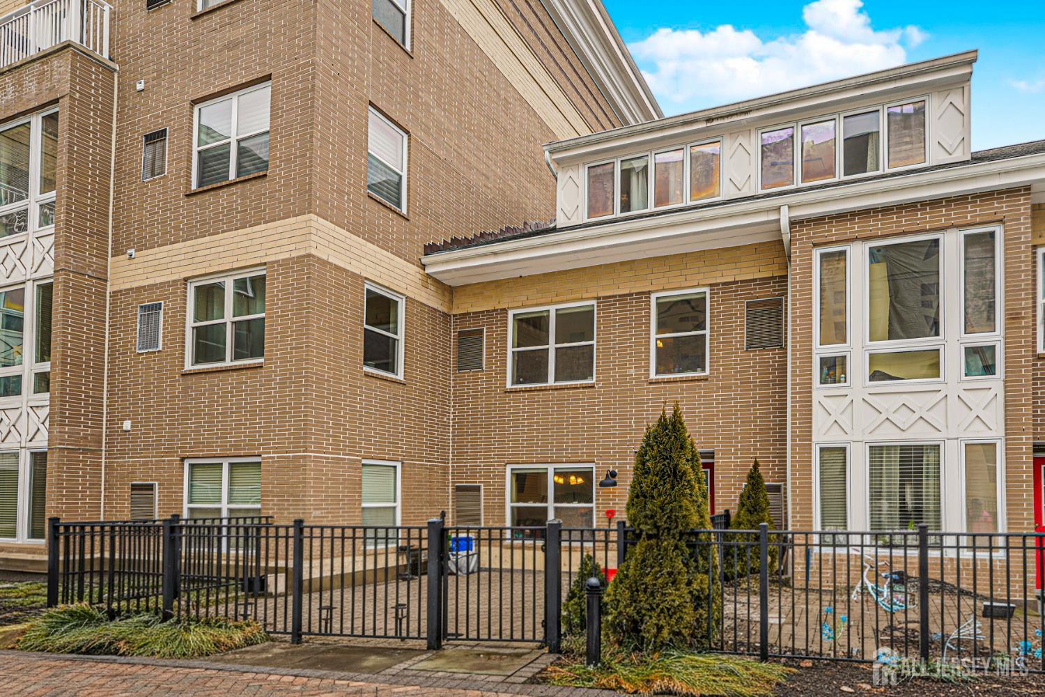 358 Rector Street, Unit 308 Perth Amboy, NJ 08861 - Photo 3 of 29 a front view of a house with glass windows