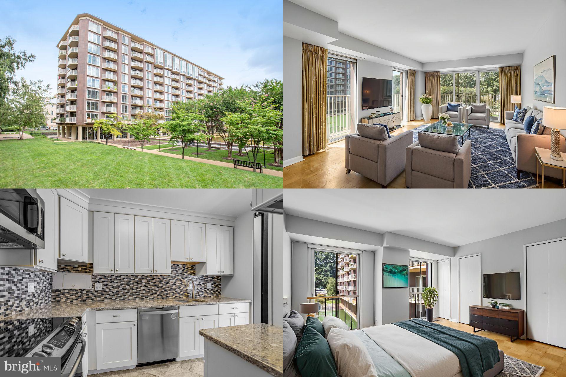 a view of kitchen with kitchen island stainless steel appliances a stove and a large window