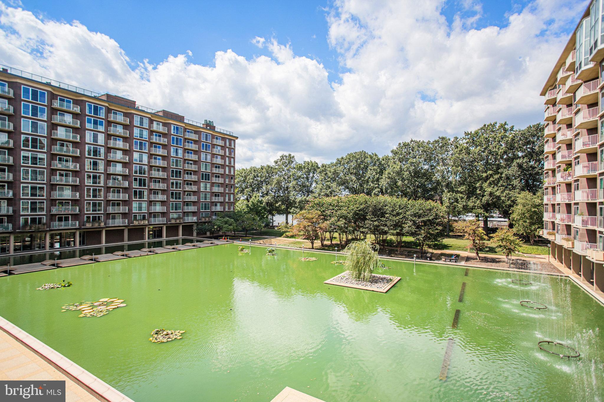 510 N Street Southwest, Unit N217 Washington, DC 20024 - Photo 19 of 19 a view of a swimming pool with a yard and seating area
