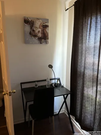 a table and chair in a gallery