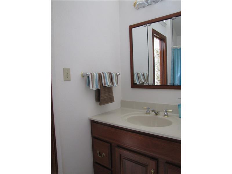 2810 Ipnar Road North Huntingdon, PA 15642 - Photo 11 of 25 Full Bath. This is the sink in the shower area, unique arrangement has both baths back to back and connecting. Cathedral ceiling and a sky light make these bathroom just a light filled oasis for bathing or a quick shower.