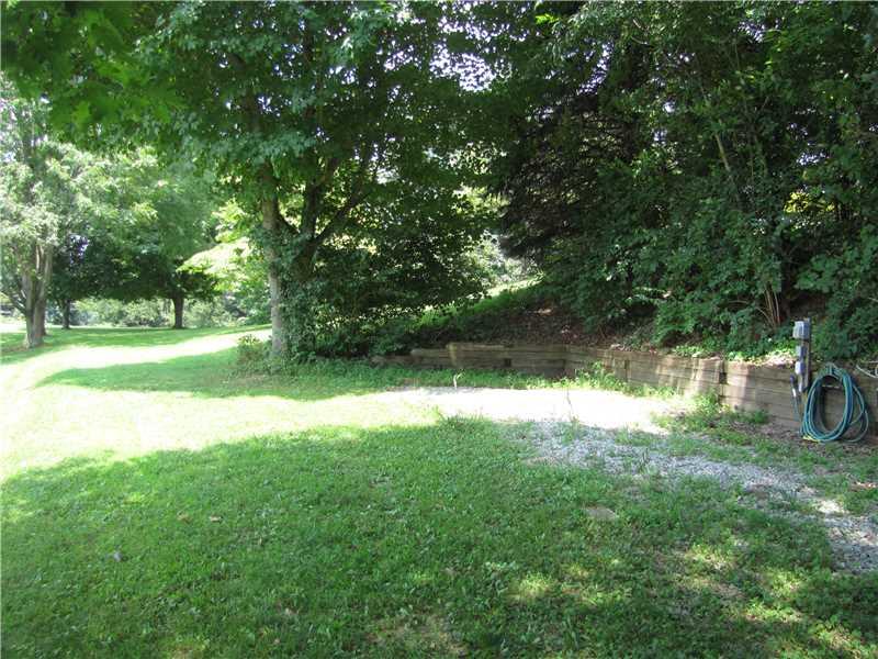 2810 Ipnar Road North Huntingdon, PA 15642 - Photo 22 of 25 Land/Lot. This area is a parking pad for an RV complete with water and electric. Private and screened off from the house and driveway.