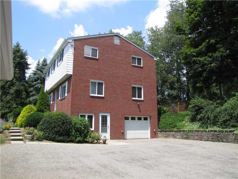 2810 Ipnar Road North Huntingdon, PA 15642 - Photo 24 of 25 Parking Lot/Garage. The side of the house showing the integral garage , walk out finished basement. Notice the exceptionally large parking area, no issues turning around and parking for plenty of guests.