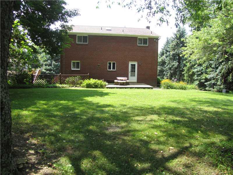 2810 Ipnar Road North Huntingdon, PA 15642 - Photo 4 of 25 Exterior Back. This view shows the exterior of the home from the backyard. Two story solid brick construction with updated windows, and doors. A wonderful backyard for picnics or yard games, add a pool or just relax in a hammock!