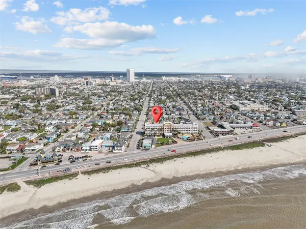 a view of parking space and a city view