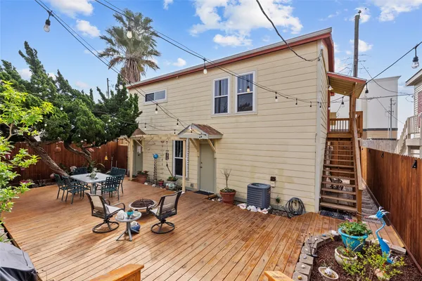 a view of a patio with table and chairs and potted plants
