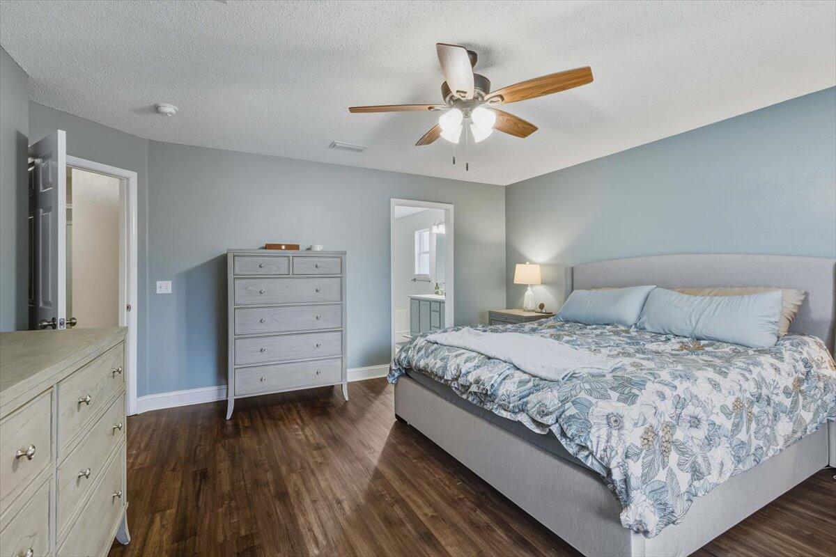 486 Jillian Drive Crestview, FL 32536 - Photo 14 of 44 a bedroom with a bed and a dresser