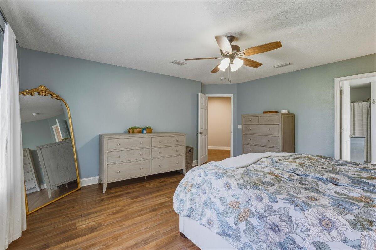 486 Jillian Drive Crestview, FL 32536 - Photo 15 of 44 a bedroom with a bed and a dresser