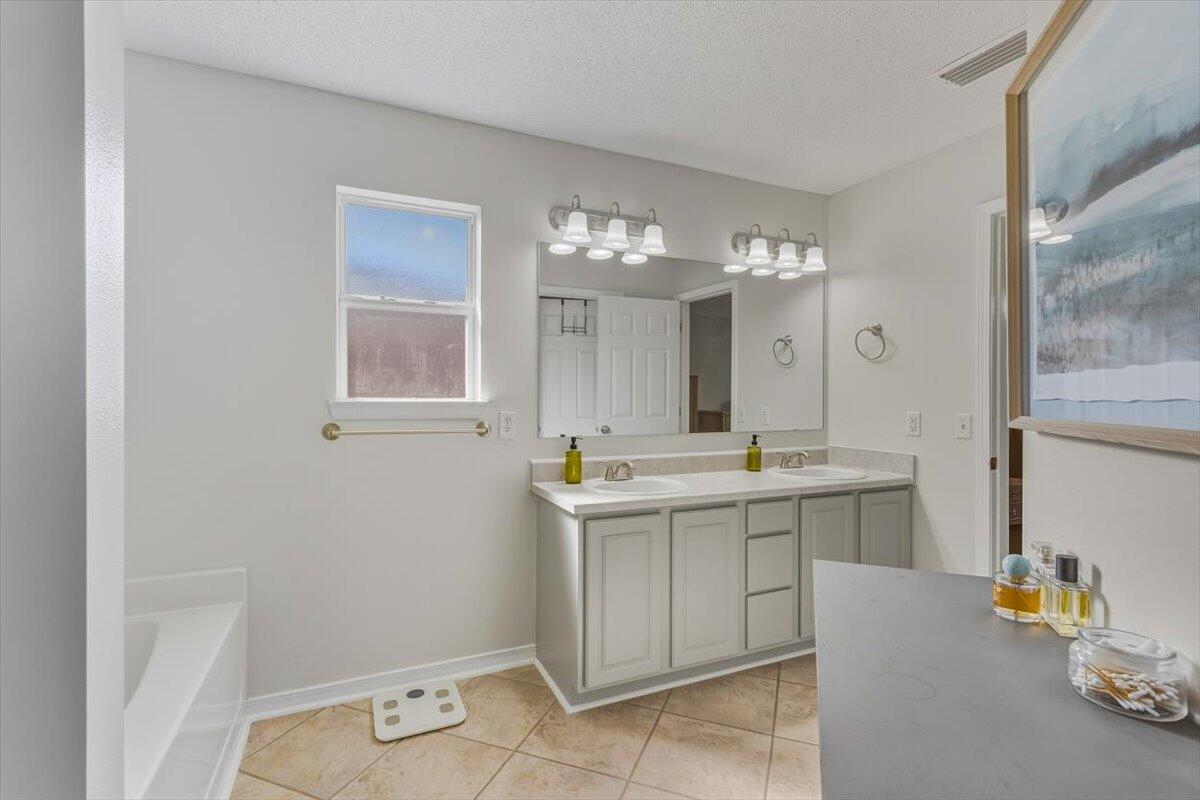 486 Jillian Drive Crestview, FL 32536 - Photo 19 of 44 a bathroom with a sink and a mirror