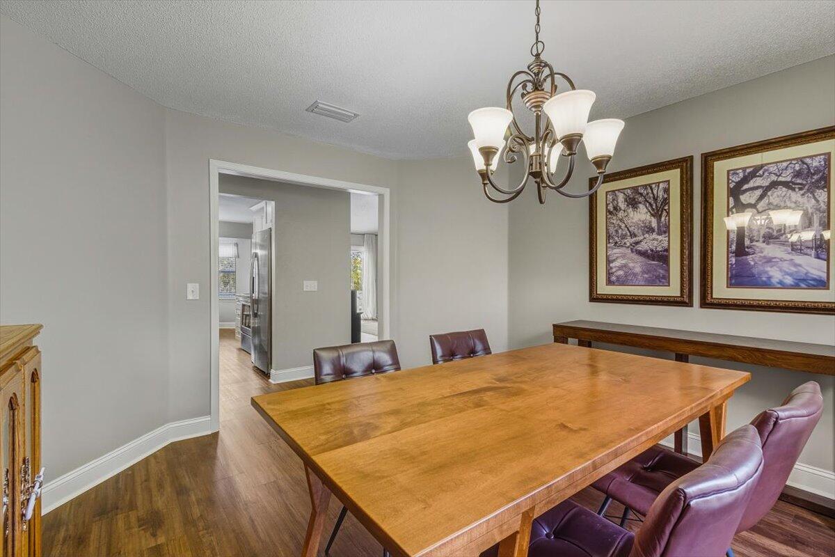 486 Jillian Drive Crestview, FL 32536 - Photo 24 of 44 a dining room with table and wooden floor