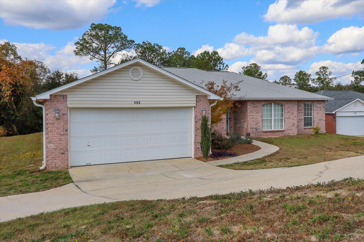486 Jillian Drive Crestview, FL 32536 - Photo 3 of 44 a view of a white house next to a yard and road