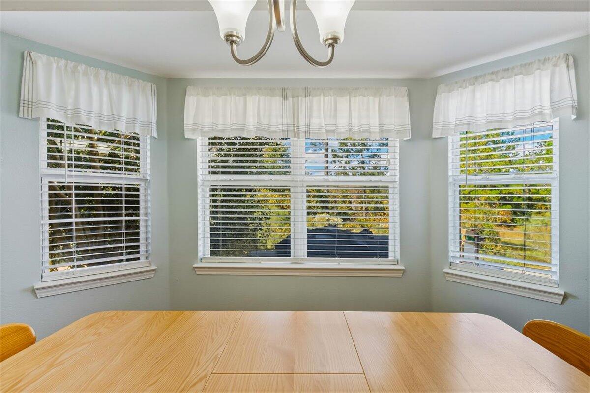 486 Jillian Drive Crestview, FL 32536 - Photo 32 of 44 a bedroom with a bed a window and a chandelier