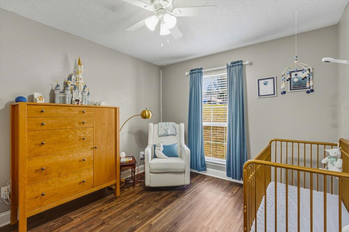 486 Jillian Drive Crestview, FL 32536 - Photo 33 of 44 a bedroom with a bed and wooden floor