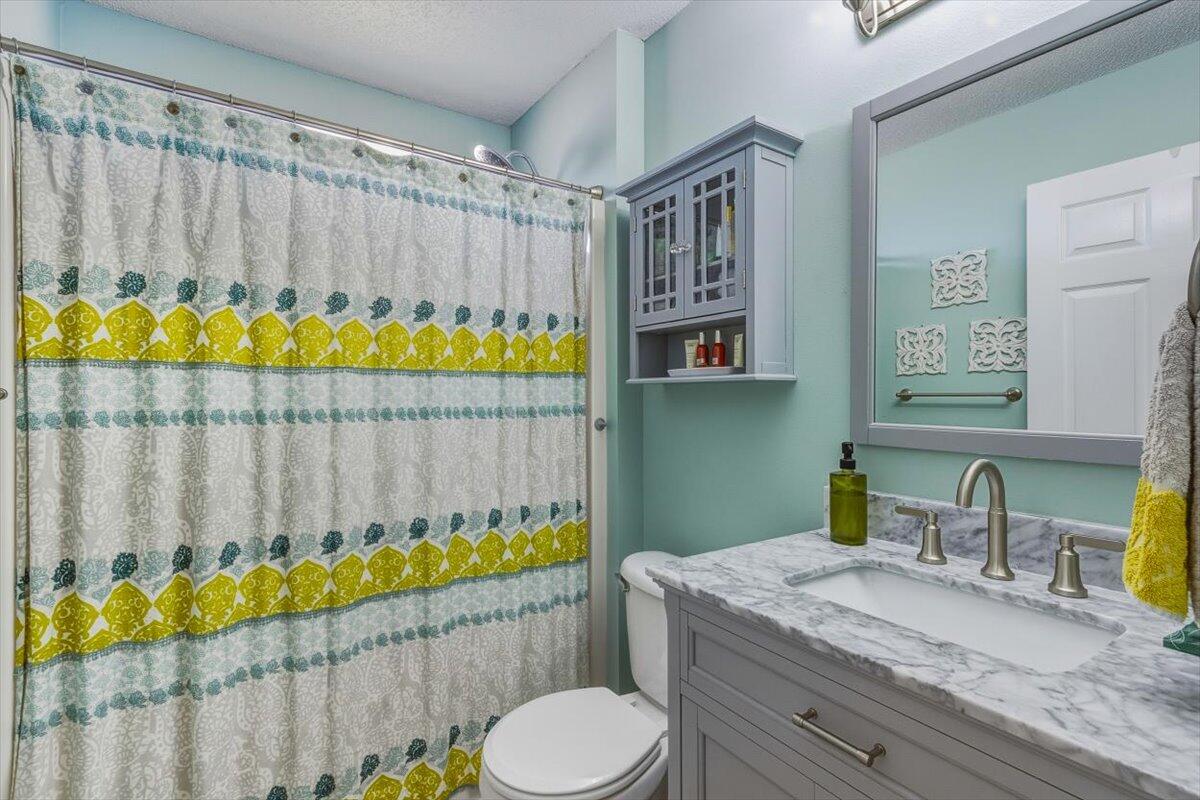 486 Jillian Drive Crestview, FL 32536 - Photo 37 of 44 a bathroom with a granite countertop sink and a mirror