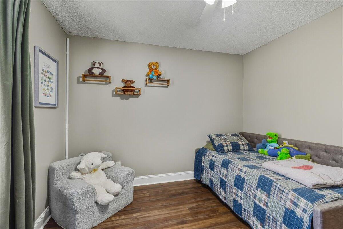 486 Jillian Drive Crestview, FL 32536 - Photo 39 of 44 a bedroom with bed and wooden floor