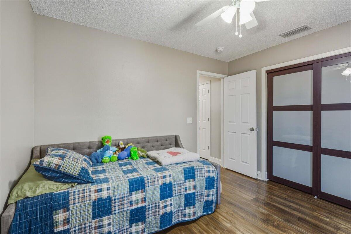 486 Jillian Drive Crestview, FL 32536 - Photo 40 of 44 a bedroom with furniture and a chandelier