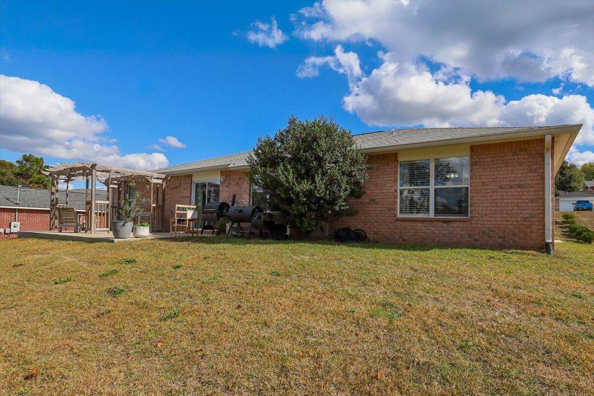 486 Jillian Drive Crestview, FL 32536 - Photo 43 of 44 a view of a house with a yard