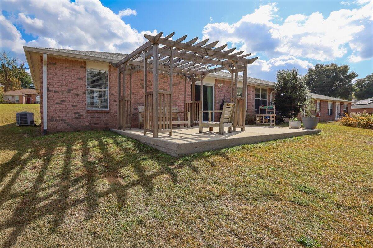 486 Jillian Drive Crestview, FL 32536 - Photo 44 of 44 a view of a house with a patio