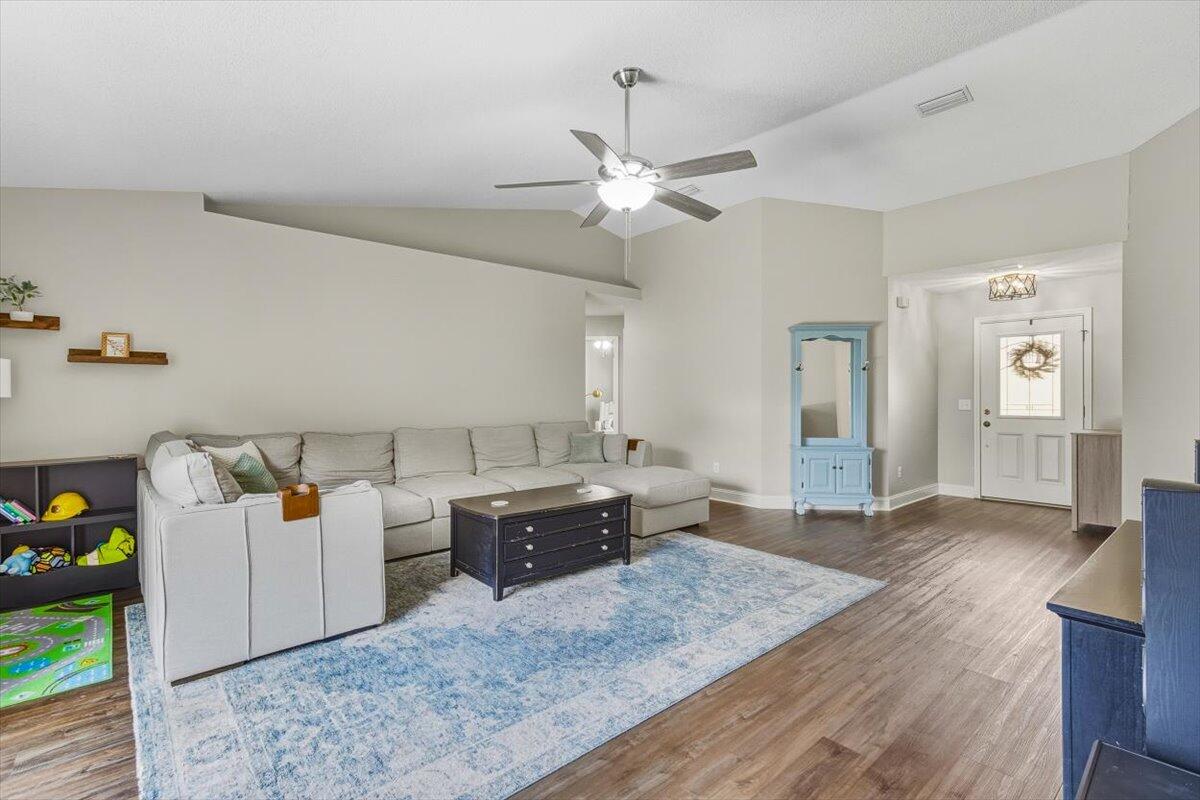 486 Jillian Drive Crestview, FL 32536 - Photo 5 of 44 a living room with furniture and wooden floor