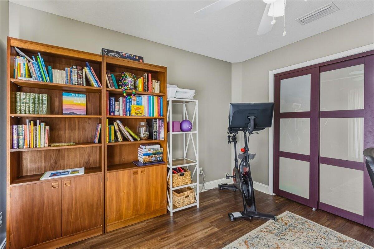 486 Jillian Drive Crestview, FL 32536 - Photo 10 of 44 a view of a workspace with furniture and book shelf