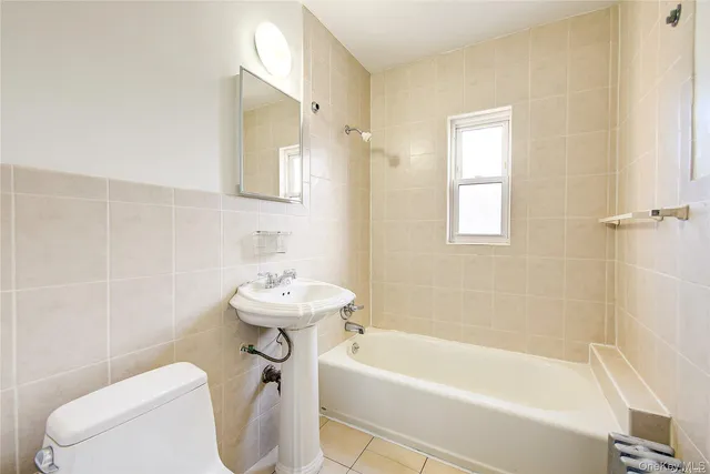 a kitchen with a sink and a refrigerator