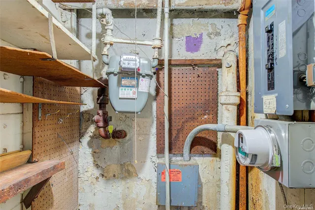 a hallway with sliding door and chandelier