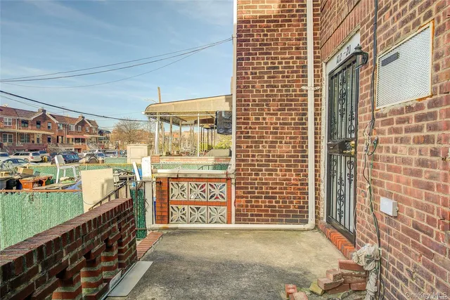 a front view of a house with large windows