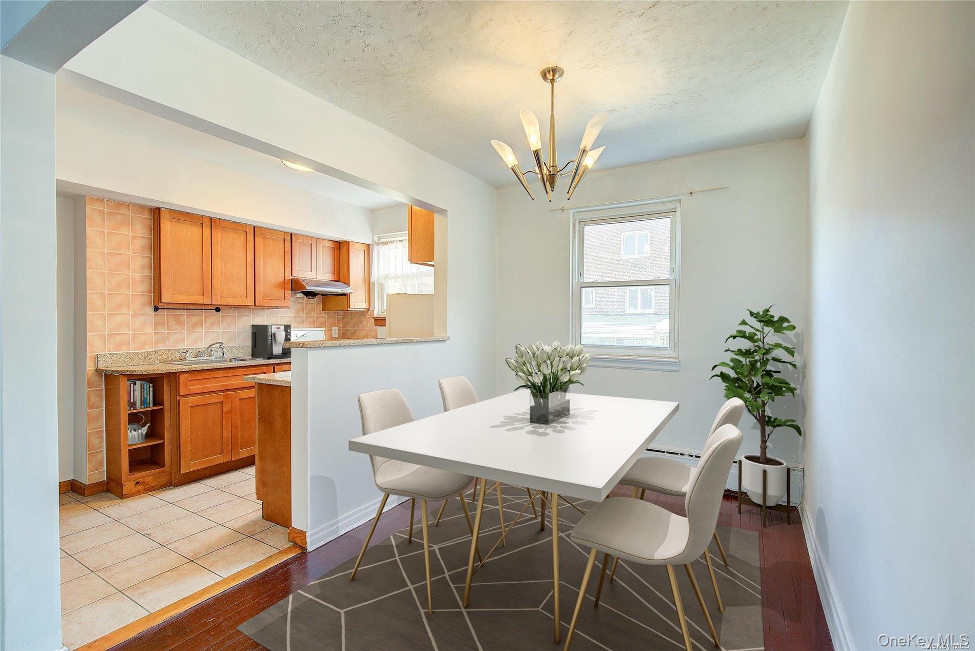 102-20 63rd Road Queens, NY 11375 - Photo 6 of 26 a view of a dining room with furniture window and wooden floor