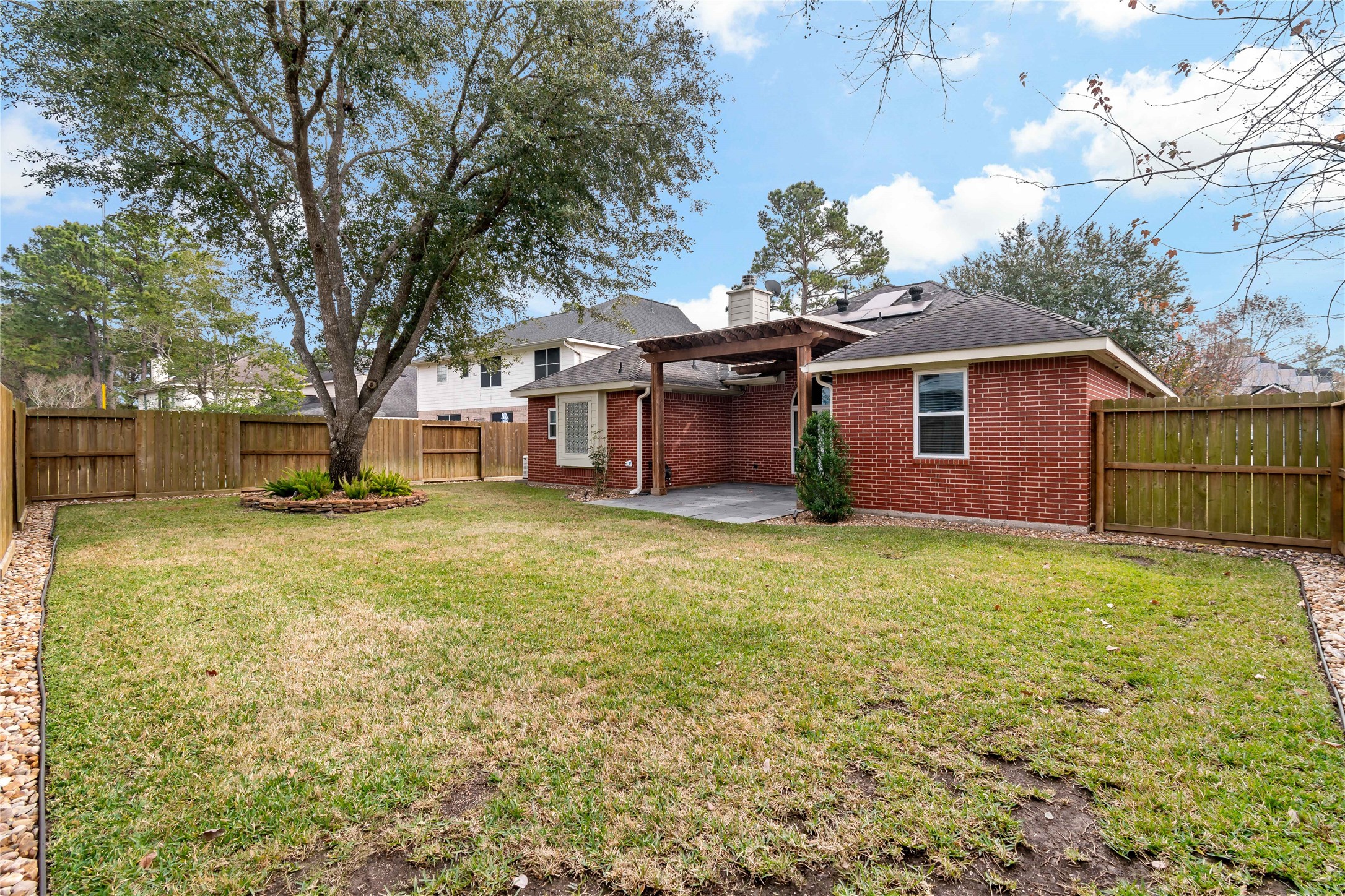 20302 Water Point Trail Humble, TX 77346 - Photo 25 of 30 Rock edging and covered back porch