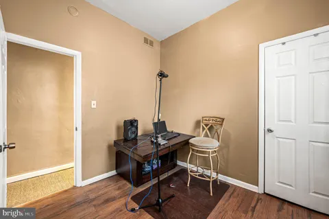 a room with furniture and wooden floor