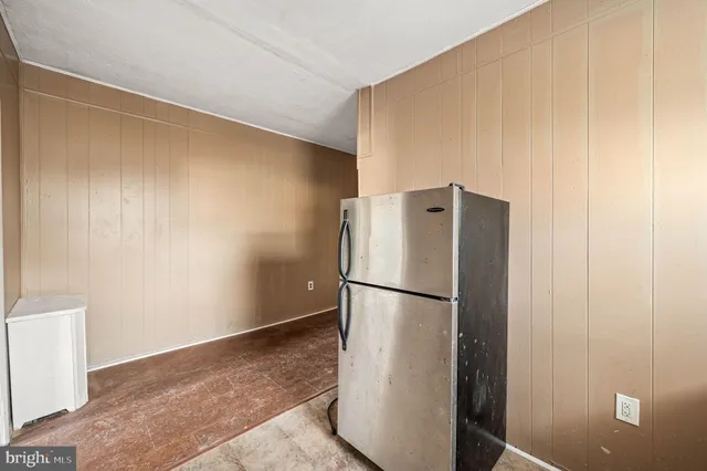 a refrigerator freezer sitting in a kitchen