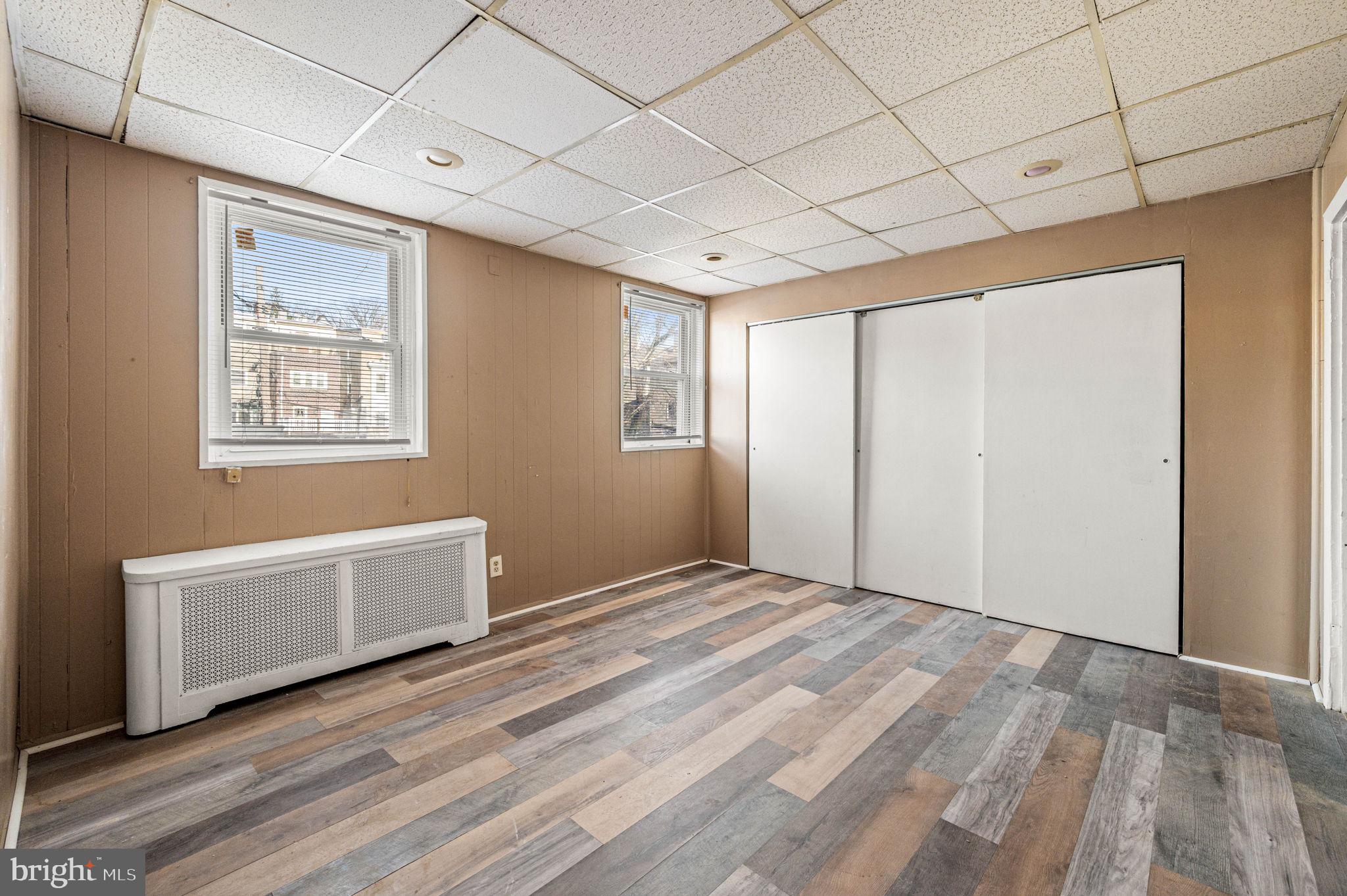 4925 Royal Street Philadelphia, PA 19144 - Photo 23 of 28 a view of an empty room with window and wooden floor