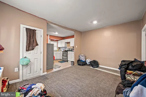a livingroom with furniture and a flat screen tv