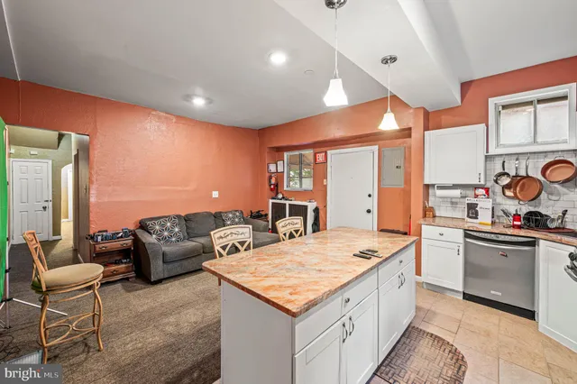 a kitchen with stainless steel appliances granite countertop a sink and cabinets
