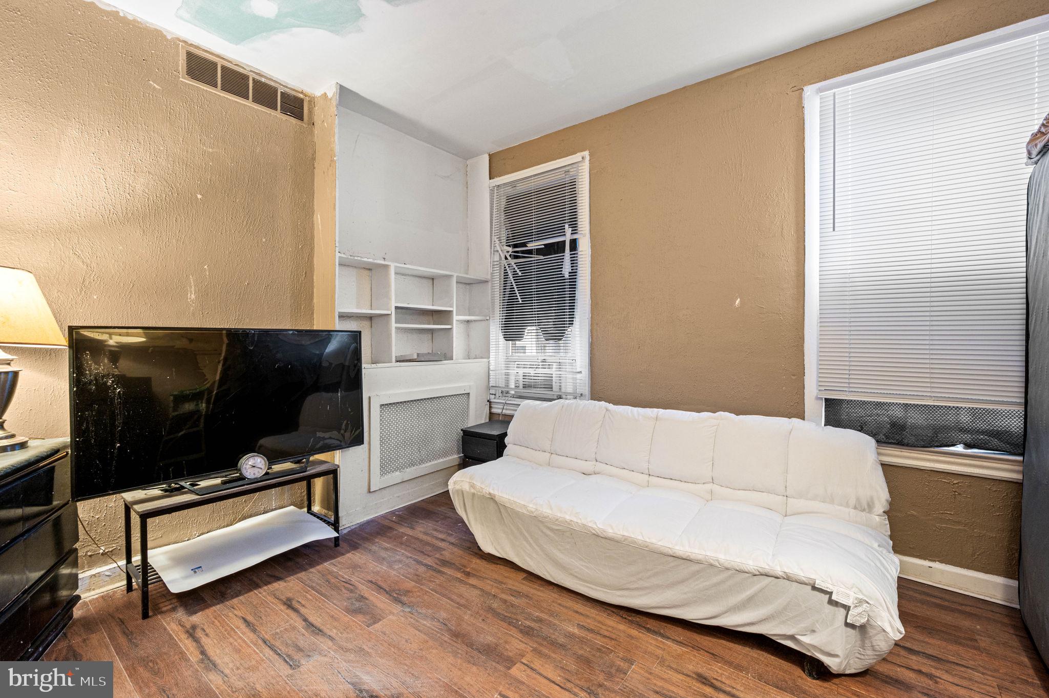 4925 Royal Street Philadelphia, PA 19144 - Photo 10 of 28 a living room with furniture and a flat screen tv