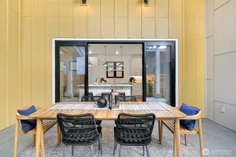 a view of a dining room with furniture and window