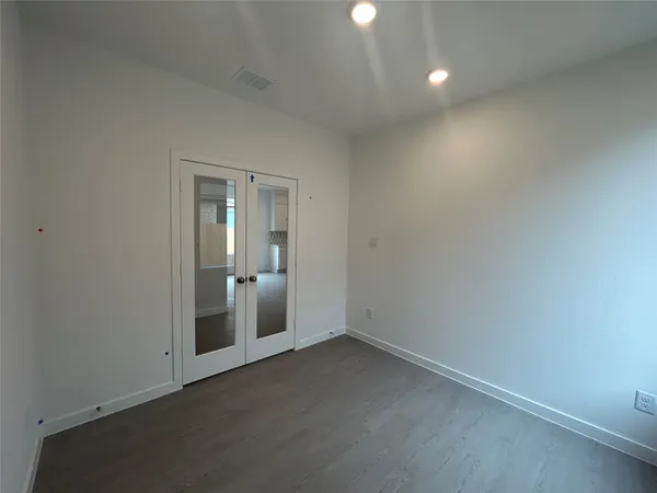 an empty room with a bathroom