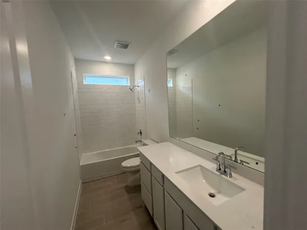 a bathroom with a sink double vanity and a mirror