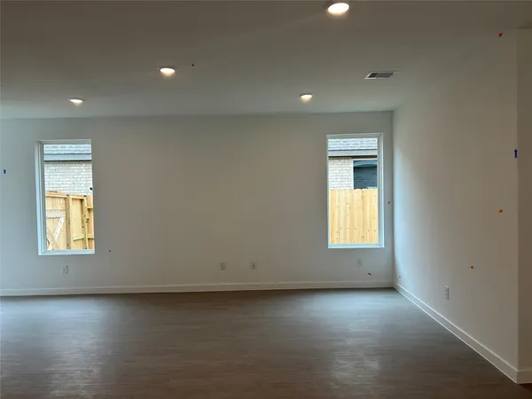 an empty room with a empty space and window