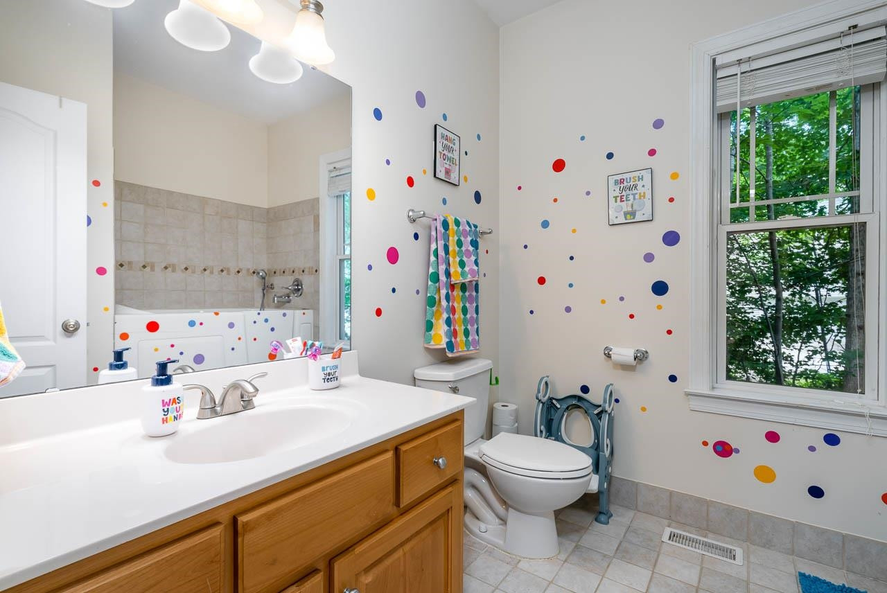 1309 Taylor Farm Road Raleigh, NC 27603 - Photo 17 of 38 Full bathroom between secondary bedrooms. Plenty of space, includes walk in tub. Bathroom