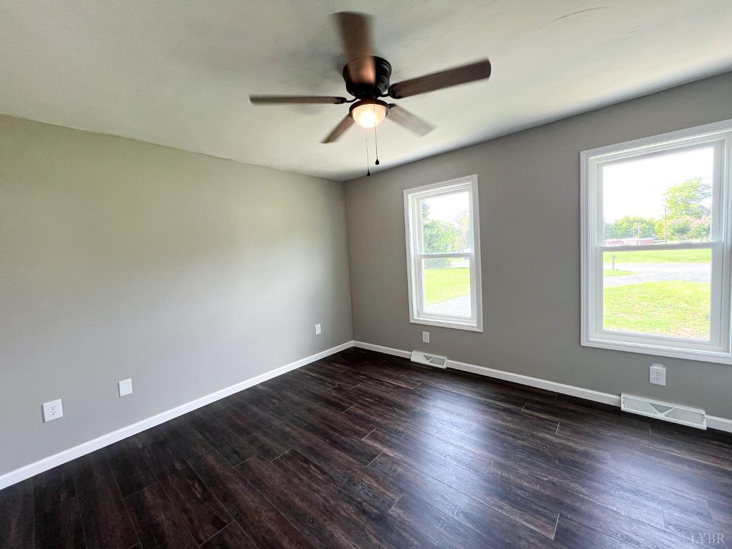 17 Phoebe Pond Road Concord, VA 24538 - Photo 13 of 19 a view of an empty room with wooden floor and a window